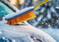 CleaningCarFromSnowWithBrush